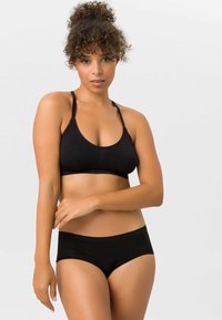 Schwarzes Bikini-Set mit einem Triangel-Bralette mit dünnen Trägern und passendem hochgeschnittenem Höschen, gefertigt aus glattem, elastischem Stoff.