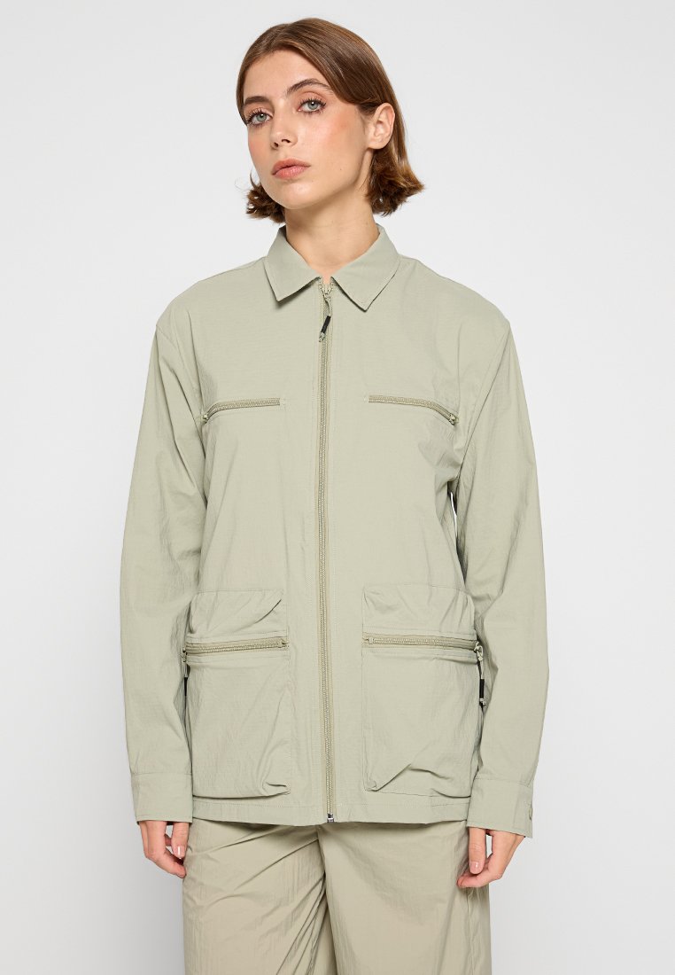 Rains Lichte jas lichtgroen Rains Lichte jas lichtgroen