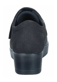 Black suede shoe with a rounded toe, cushioned heel, and textured rubber sole. Features a low platform for added height.