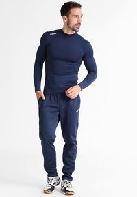 Joma NILO - Spodnji deli trenirk - navy