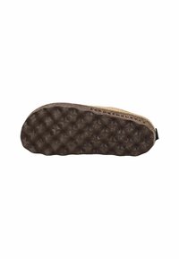 Suela de zapato con un patrón texturizado y ondulado en goma marrón oscura, unida a la parte superior beige del zapato.