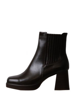 Bottine noire en cuir avec talon bloc et panneau latéral élastique, finition lisse et bout arrondi.