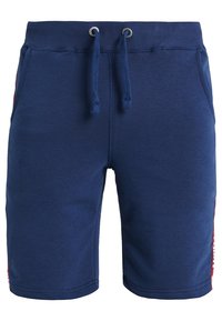 Shorts en coton bleu marine avec une taille élastique, un cordon de serrage, des poches latérales et des accents rouges contrastants sur les côtés.