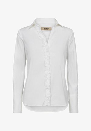 White long-sleeve shirt in cotton with a ruffled front placket, traditional collar, and rounded hemline, featuring buttoned cuffs.