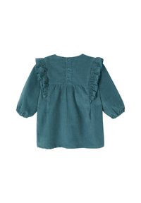 Türkise Corduroy-Bluse mit langen Ärmeln, Rüschenakzenten an den Schultern und einer Knopfverschluss an der Rückseite. Weicher Stoff und lockere Passform.
