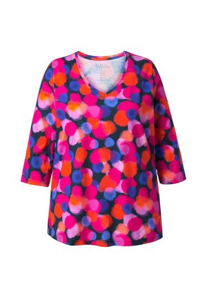 Haut coloré à col en V avec une base bleu marine ornée de gros pois roses, oranges et violets, manches trois-quarts. Tissu doux.