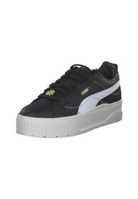 Sneakers in pelle nera con una striscia bianca, suola bianca spessa, dettagli dorati e un finish texture. Presentano lacci tondi e branding laterale.