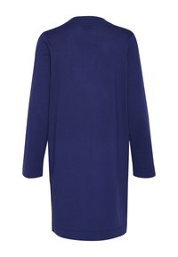 Marineblauwe, lange mouwen tuniek met een ronde hals. Soepele textuur, valt net boven de knieën, met zijsplitten aan dezoom.