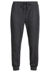 Grå atletiska sweatpants med dragsko i midjan, ribbstickade mudd och sidofickor. Tillverkade av mjukt material med en slät yta.