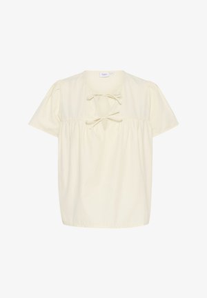 Kreemivärviline lühikeste varrukatega topp, kogutud talje ja sidumistegevusega kaeluses. Pehme puuvillane kangas, lõtv istuvus.