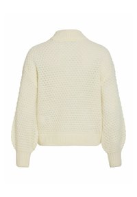 Pull tricoté couleur crème avec un motif texturé, manches longues bouffantes, poignets, ourlet et col montant côtelé.