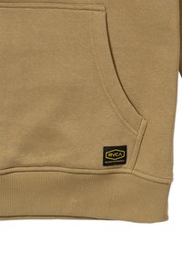 Tan hoodie made of soft fabric, featuring a front pocket, ribbed cuffs, and a black and yellow RVCA label at the bottom.