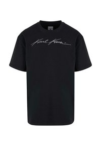 T-shirt en coton noir à manches courtes et col rond. Présente un texte en cursive blanc bien en vue sur la poitrine. Design simple et classique.