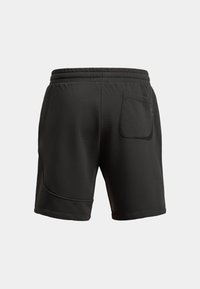 Pantaloni sportivi neri con cintura elasticizzata, texture liscia, una singola tasca posteriore e un dettaglio a cucitura curva sui lati.