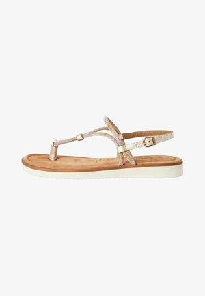 Gold-tone flat sandals featuring a T-strap design with beaded accents, a cushioned footbed, and a white rubber outsole.