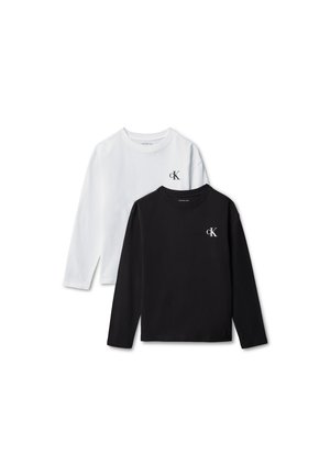 To langærmede crew neck t-shirts, én sort og én hvid, begge med et lille "cK" logo på venstre bryst.