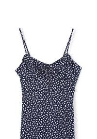 Robe bleu marine avec un motif floral blanc, fines bretelles doubles, et détail de nœud à l'avant au niveau de la poitrine.