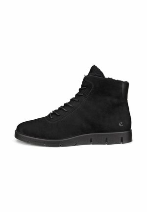 Black suede ankle boots with lace-up closure, soft lining, textured surface, and a rubber sole featuring horizontal grooves for traction.