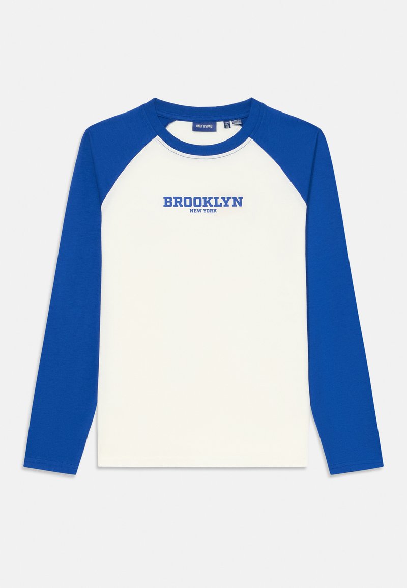 Long-sleeve raglan shirt with a white body and royal blue sleeves. Features "BROOKLYN NEW YORK" in blue text on the chest. Cotton material.