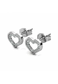 Orecchini a forma di cuore in argento con un centro vuoto, adornati con piccoli cristalli trasparenti lungo il bordo. Chiusura semplice con perno.