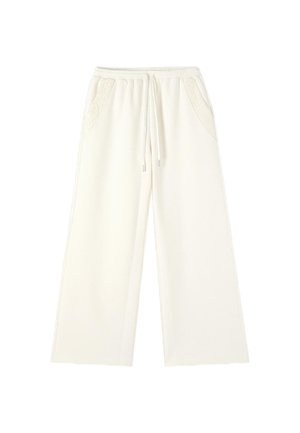 Pantalones de pierna ancha color crema con cintura elástica, cordón ajustable y detalle de encaje en los bolsillos delanteros.