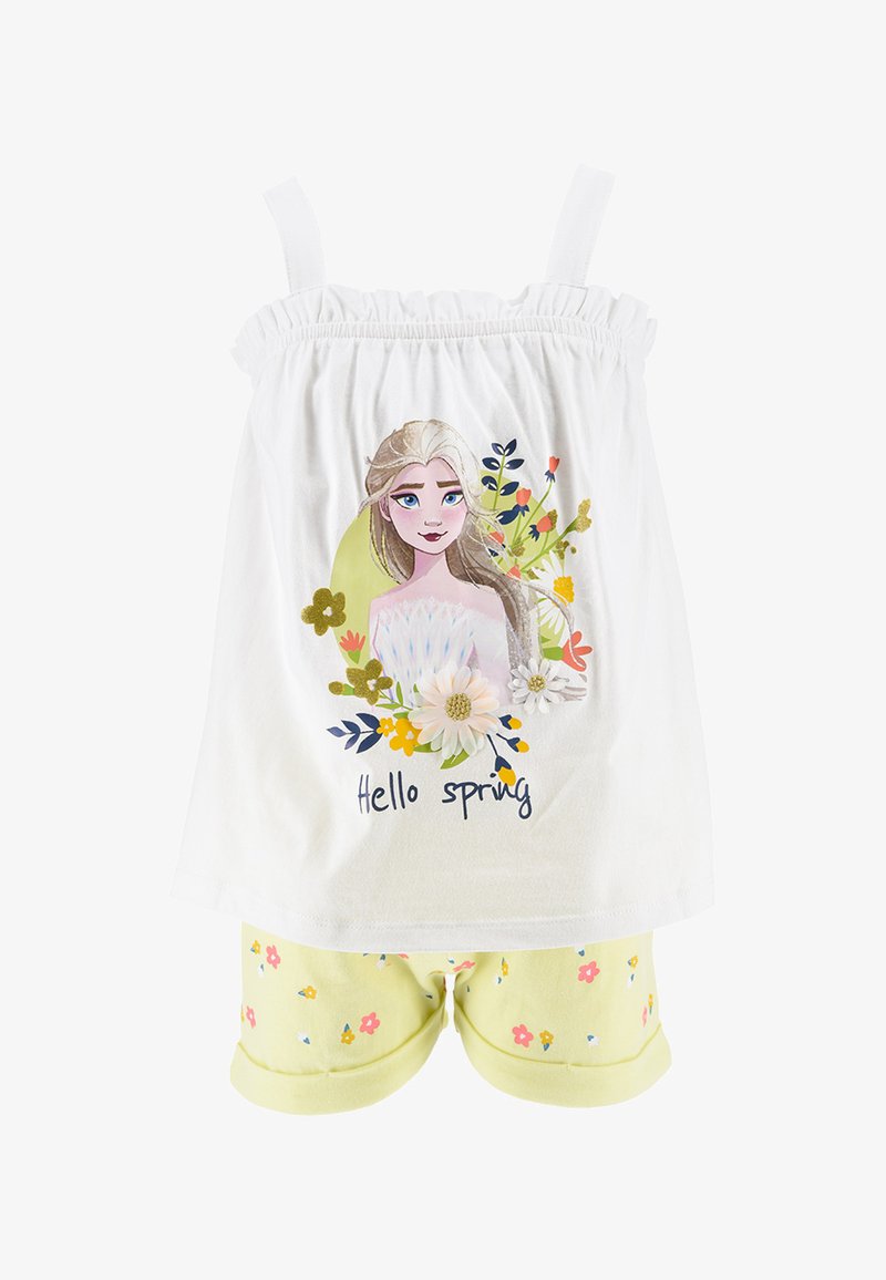 Top blanco sin mangas con tirantes elásticos, con un diseño floral y el texto "Hola Primavera". Combinado con pantalones cortos amarillos claros con patrones florales.