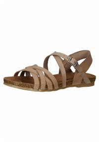 Beige leather sandals feature multiple crisscross straps, a cork footbed, and a back strap with an adjustable metal buckle. Flat sole design.