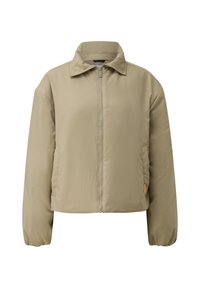 Veste matelassée beige avec zip frontal intégral, col pointu, poignets élastiques et poches latérales, présentée sur fond blanc.