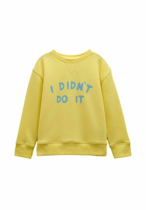 Yellow crewneck sweatshirt with blue text "I DIDN'T DO IT" on front, featuring ribbed cuffs and hem.