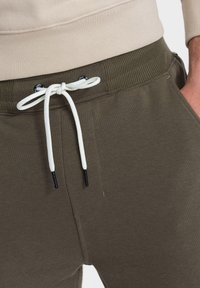 Ombre Jogginghose - dark olive