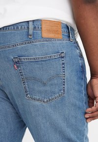 Levi's® Plus Jeans Tapered Fit - blue denim