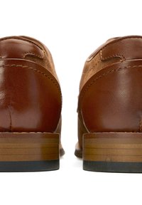 Brown leather shoes with a smooth finish, featuring a stacked heel and decorative stitching along the upper, viewed from the back.