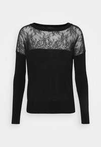 Schwarzer Pullover mit transparentem Spitzeneinsatz und aufwendigen Mustern, langen Ärmeln und rundem Ausschnitt. Weiches Strickmaterial am Körper.