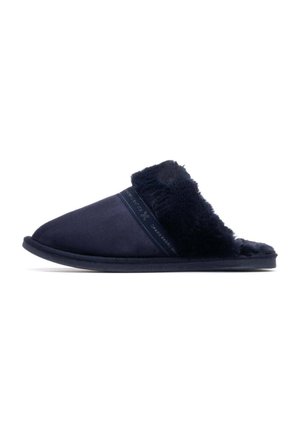 Pantuflas azul marino con un suave forro de piel sintética, parte superior de ante suave y suela acolchada. Diseño minimalista con acentos simples.
