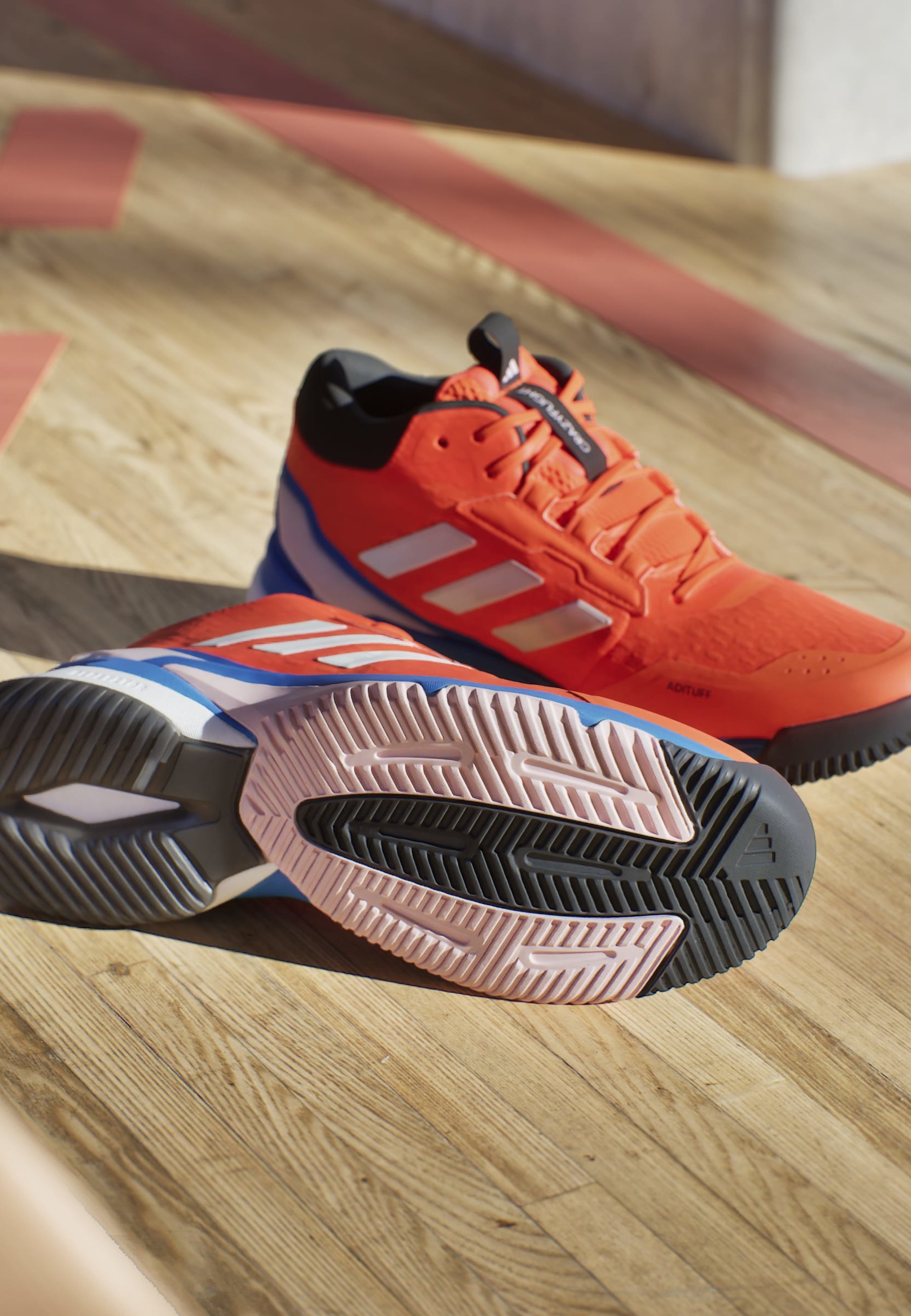 orange and black adidas basketball shoes