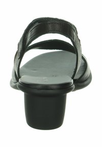 Sandal in pelle nera con due ampie cinghie e punta rotonda. Presenta un tacco basso e massiccio e una superficie liscia.