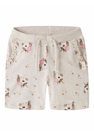 Shorts beige pour enfants avec taille à cordon, poches avant froncées et visages de licornes avec fleurs roses imprimées partout.