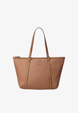 Brown leather tote bag with a spacious design, featuring long handles, zipper closure, and embossed logo detail on the front.