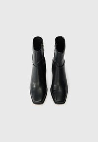 Black leather ankle boots with a square toe design, featuring a side zipper and a smooth texture. No visible patterns or hardware details.