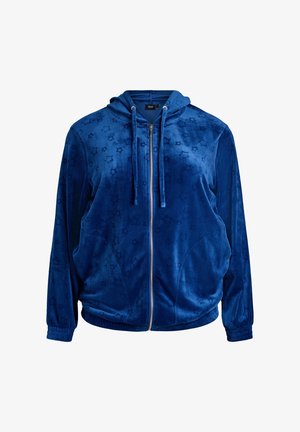 Felpa con cappuccio blu velluto con cerniera, motivo a stella texturizzato, due tasche frontali e cappuccio con coulisse. Polsini e orlo a costine. Finitura morbida.