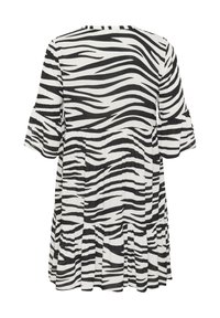 Schwarz-weißes, zebramusteriges Kleid mit einem schwingenden Ärmel-Design, einem taillierten Oberteil und einem gestuften Volant-Saum. Leichter Stoff mit strukturiertem Finish.