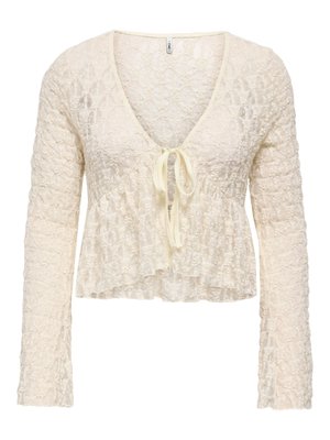 Cardigan court en dentelle crème, manches longues, col profond en V et fermeture par lien devant.