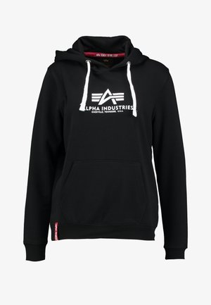 Svart huvtröja i bomullsblandning, med en framficka, vita dragband och en Alpha Industries-logga på bröstet.