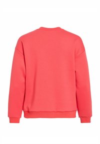 Sweat-shirt en coton corail avec encolure ronde, manches longues, poignets et ourlet côtelés, avec une texture lisse et un design simple.