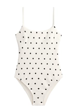 Hvid badedragt i ét stykke med tynde stropper og jævnt fordelt små sorte polkaprikker over hele stoffet.