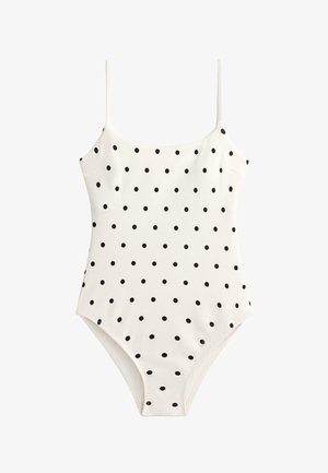 Weißer Einteiler-Badeanzug mit dünnen Trägern und gleichmäßig verteilten kleinen schwarzen Polka-Dots über den gesamten Stoff.
