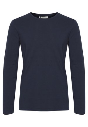 Marineblaue Langarm-T-Shirt aus weichem Baumwollmaterial. Verfügt über einen runden Halsauschnitt und ein körpernahes Design. Glatte Textur ohne sichtbare Muster oder Akzente.