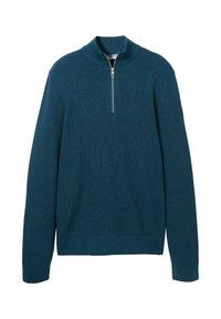 Tengeréskék pulóver bordázott mintával, félig cipzáros gallérral és hosszú ujjakkal. Egyszínű teste van, a felső részen vízszintes bordákkal.