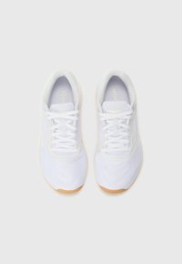 White athletic shoes with a textured mesh upper, lace-up design, and a light brown rubber outsole. Features subtle branding.