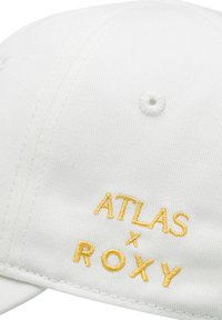 White cap made of fabric with embroidered text "ATLAS x ROXY" in yellow. Features a structured shape and a button at the top.
